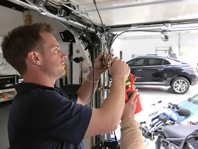 Pembroke Pines Garage Door Repair safety certified technician performing cable replacement in Pembroke Pines