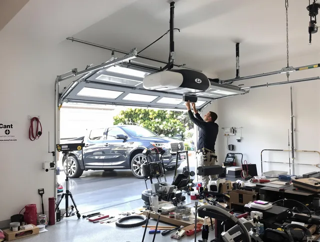 Pembroke Pines Garage Door Repair specialist installing smart garage door opener system in Pembroke Pines home